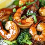 Honey garlic butter shrimp and broccoli served with rice.