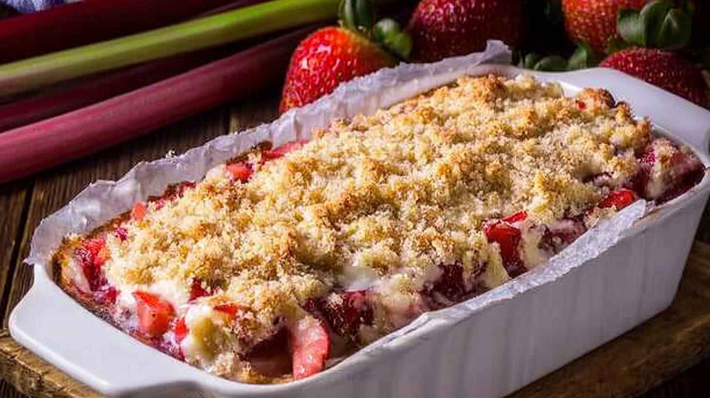 Rhubarb Breakfast Cake: Moist, Golden & Perfectly Tart 2 Freshly baked strawberry rhubarb loaf cake in a white pan